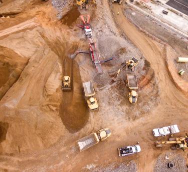 Aerial photography of trucks on construction site